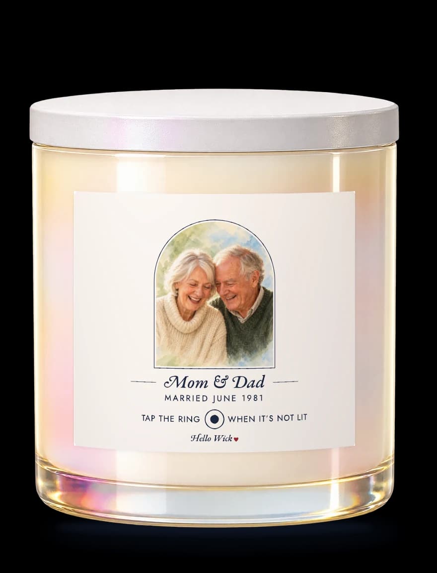 A Hello Wick candle labelled Mom & Dad, married June 1981, with a watercolour of the two of them in an arch