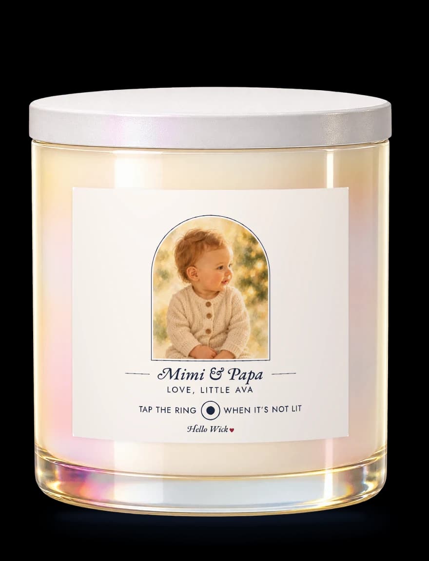 A Hello Wick candle labelled Mimi & Papa, love, little Ava, with a watercolour of the baby in an arch