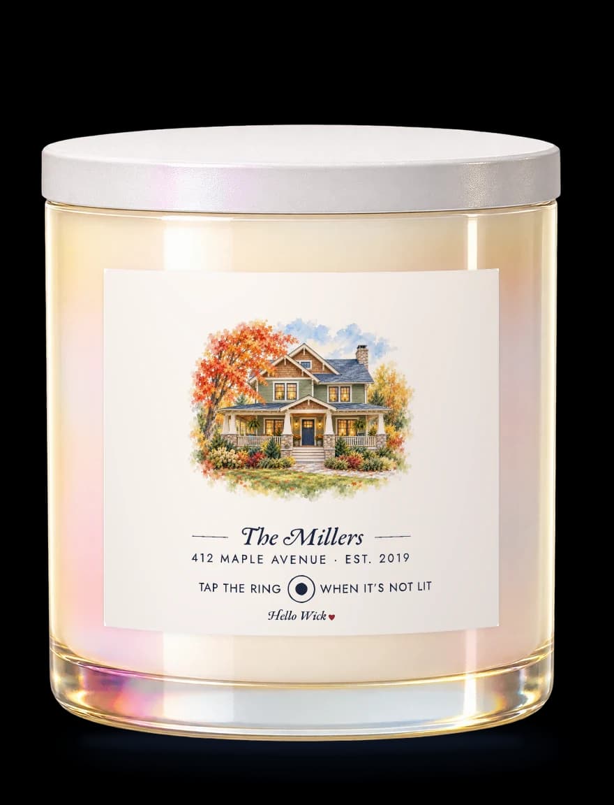 A Hello Wick candle labelled The Millers, with a watercolour of their house