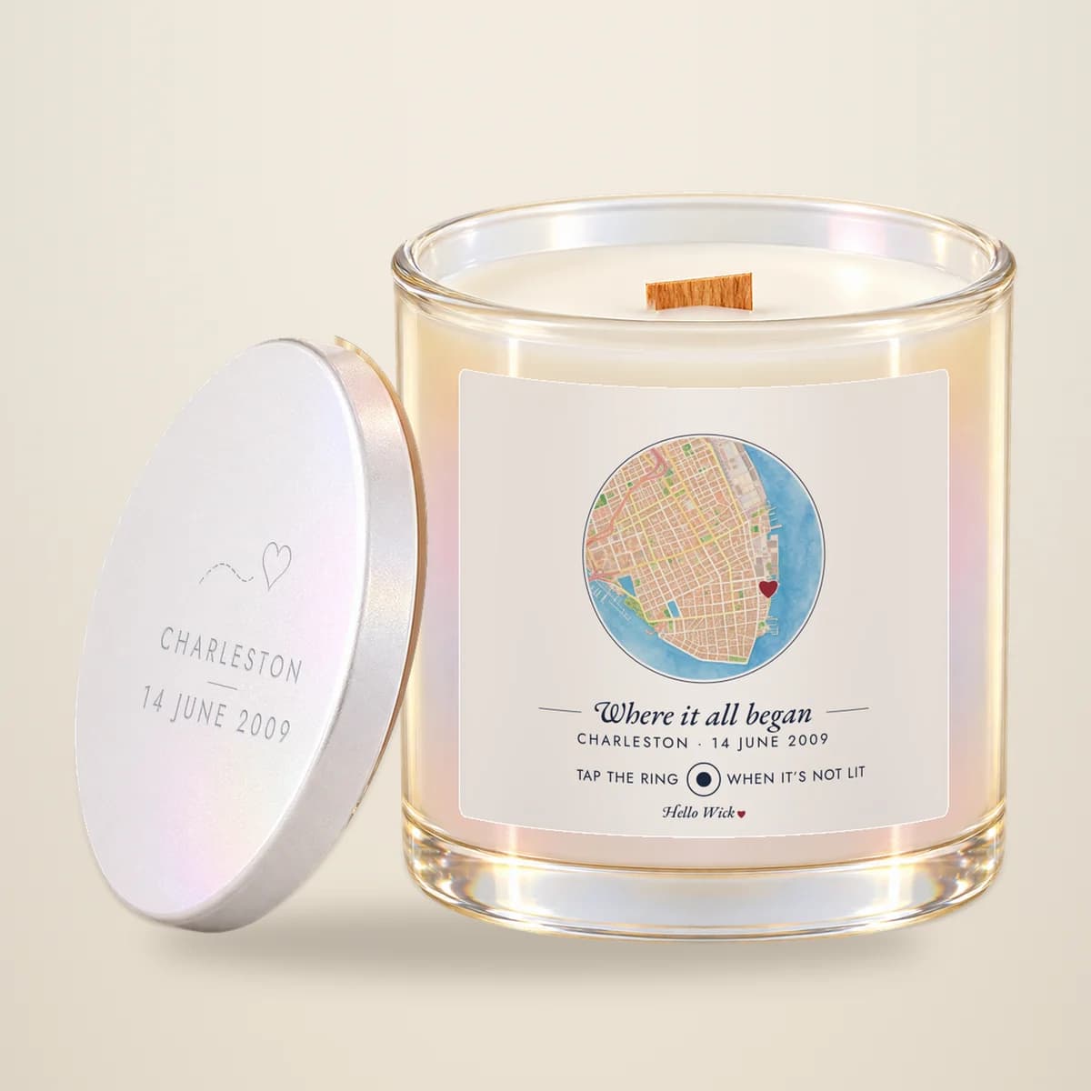 A Hello Wick candle labeled Where it all began, with a round watercolor map of Charleston and a heart